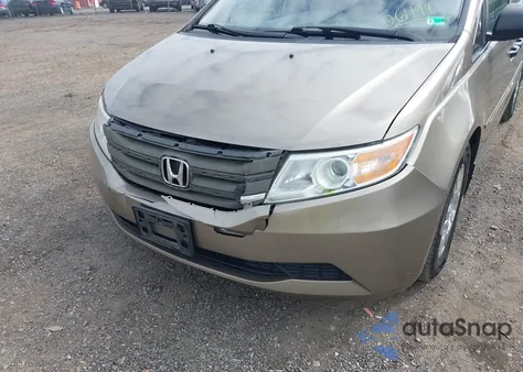 2012 Honda Odyssey Lx z USA, uszkodzony, nr VIN 5FNRL5H2XCB061198